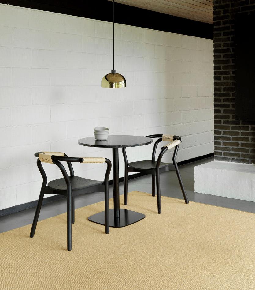 Black wick chair with a natural string