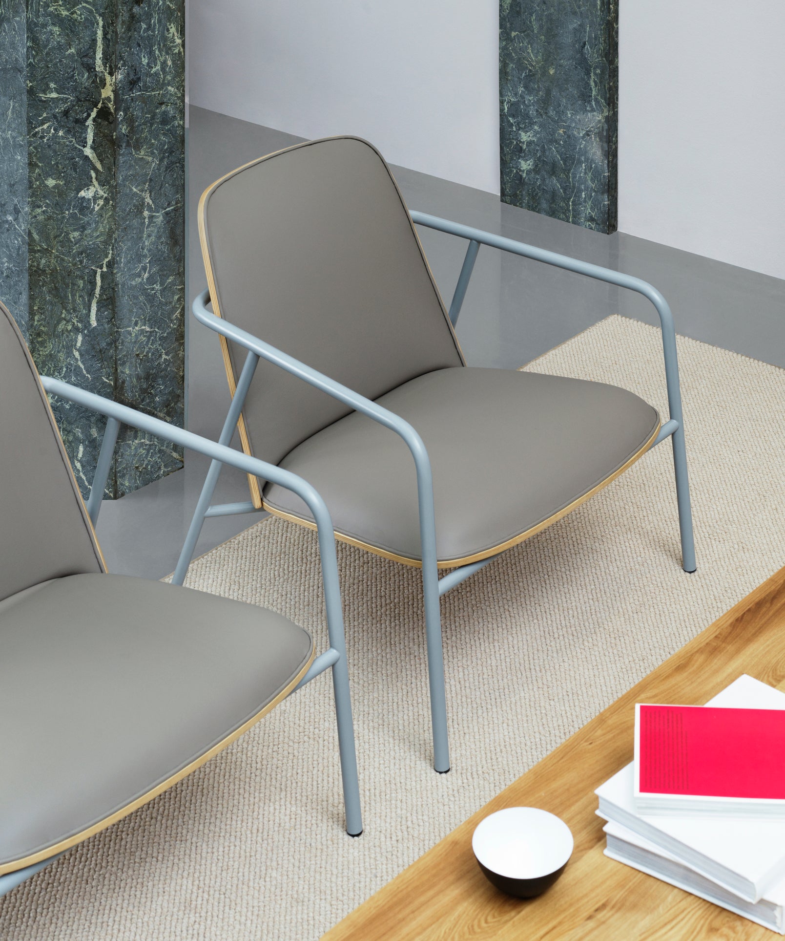 Upholstered armchair pad low oak veneer with a gray base