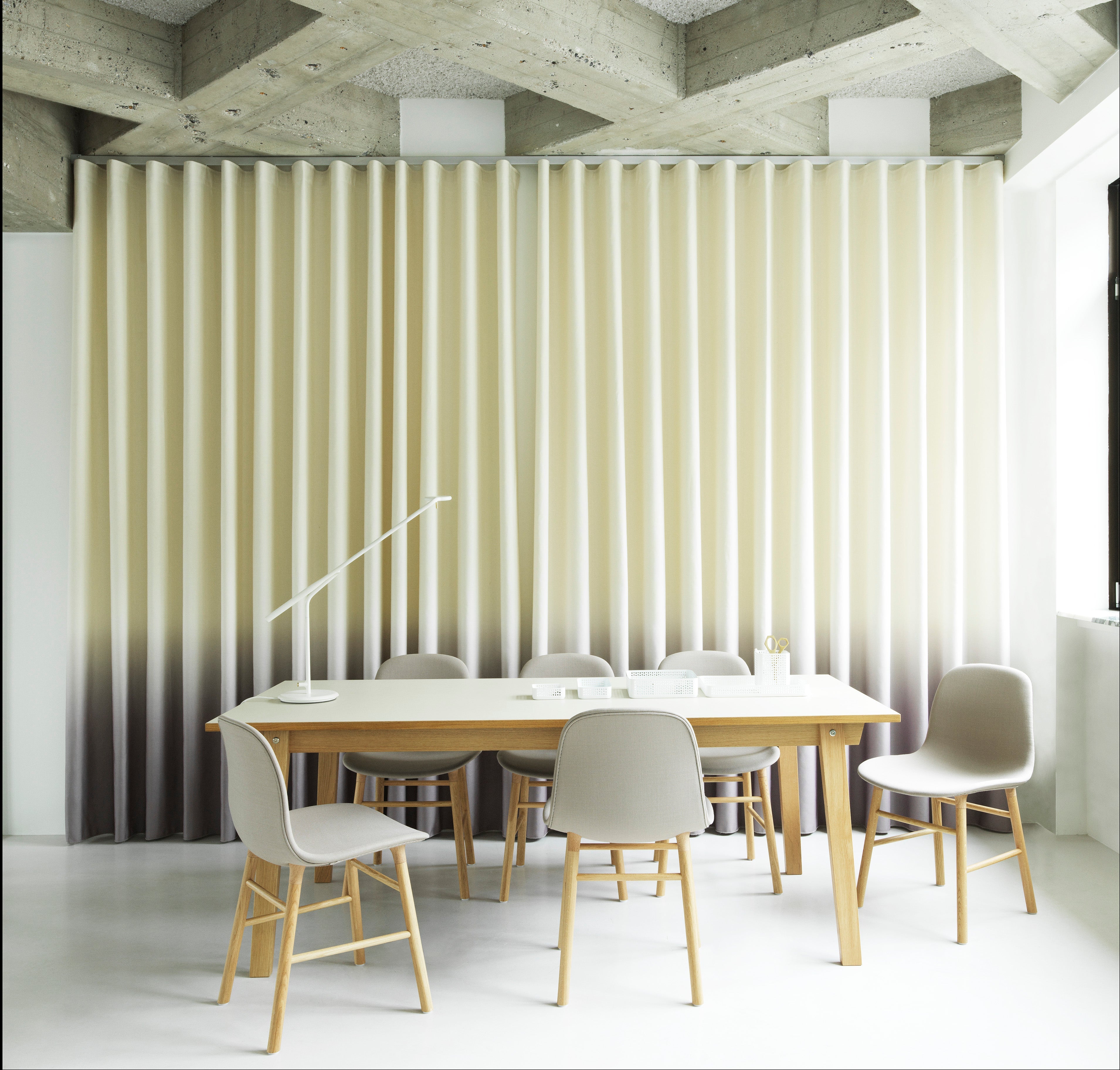 Upholstered chair forms with an oak base