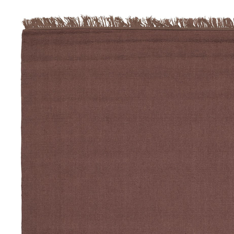 UNE burgundy rug