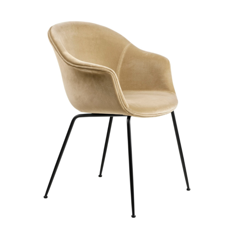 Upholstered BAT chair with a black metal base