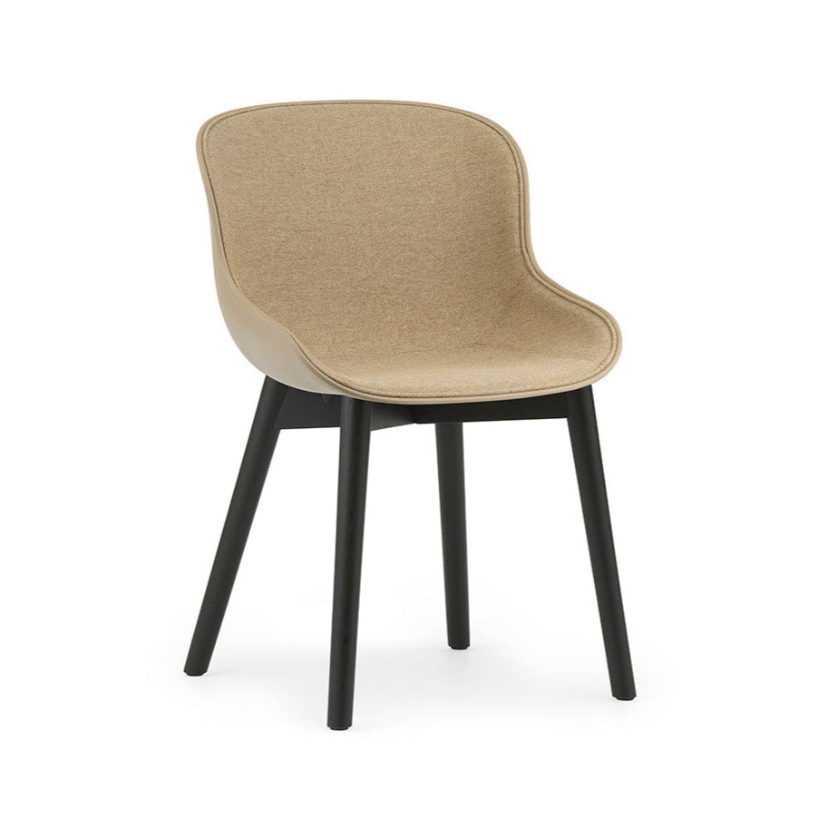 Upholstered chair of sand hyg with a black oak base