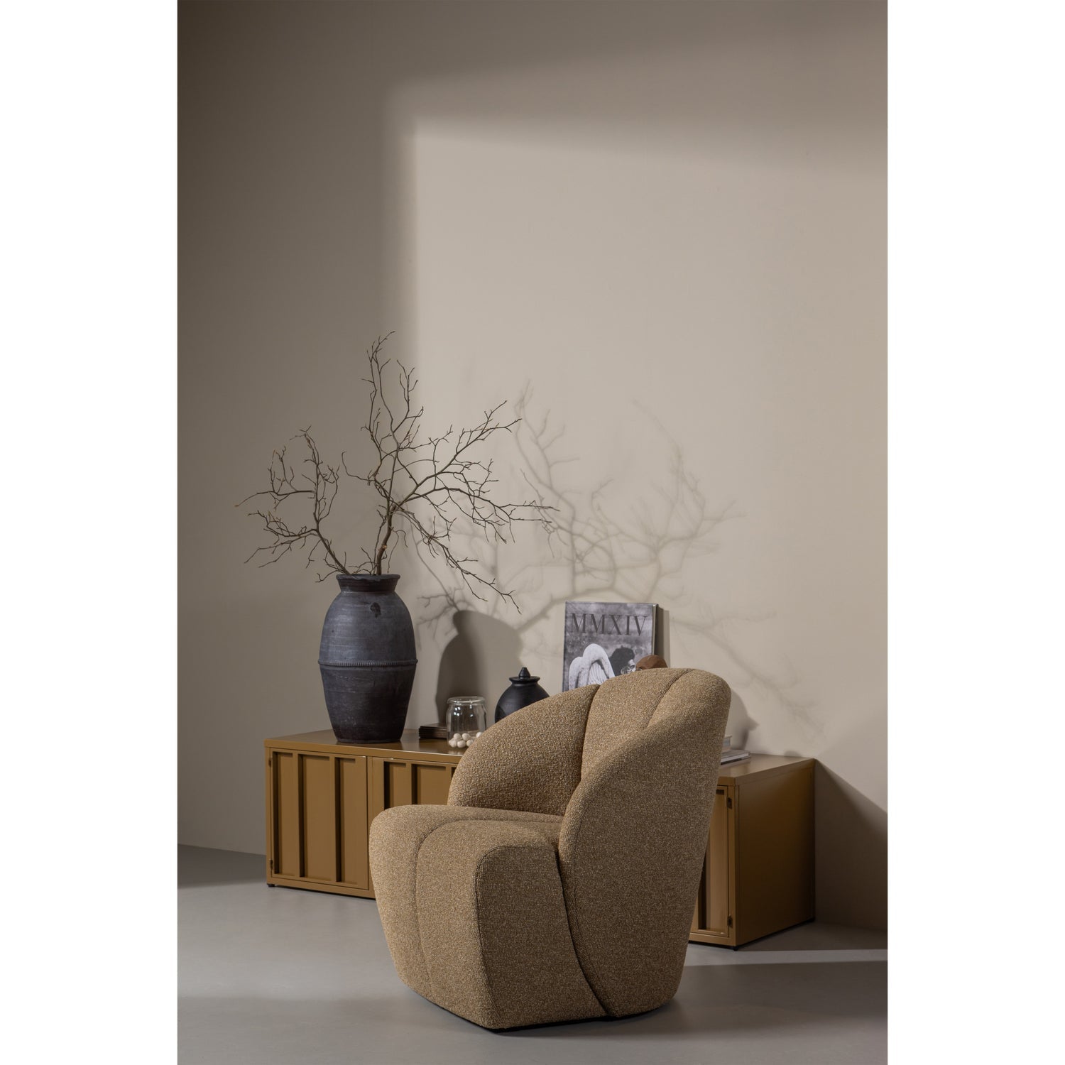 MOJO swivel armchair dark honey bouclé