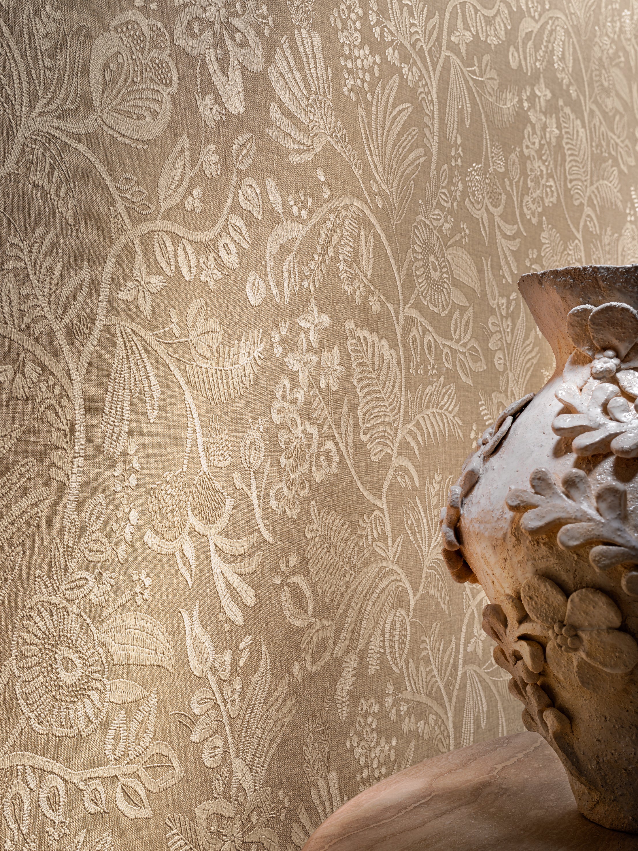 Structural wallpaper imitating embroidery with a floral and leaf pattern PASTEL - NUDE dark beige