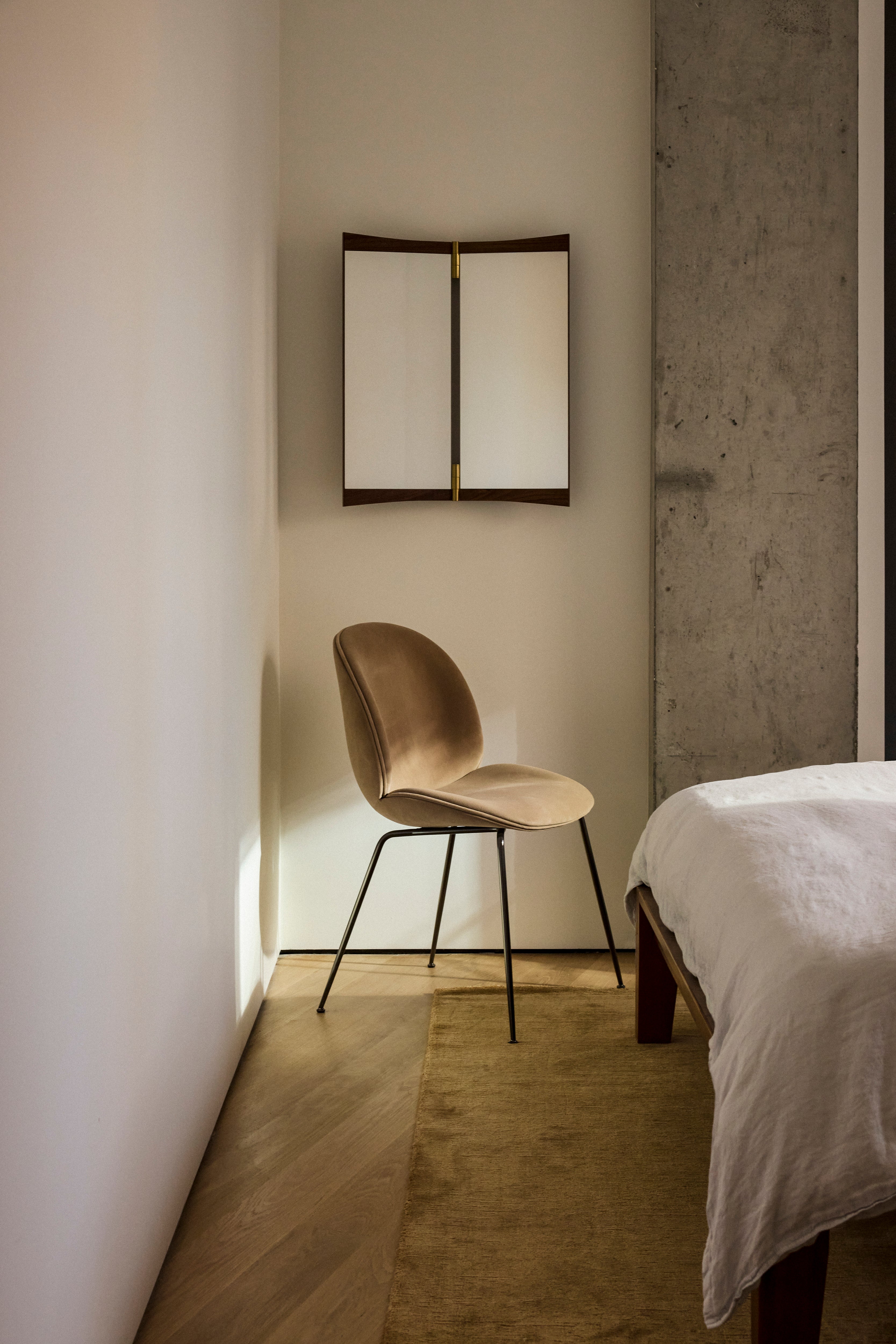 BEETLE upholstered chair with a black steel base