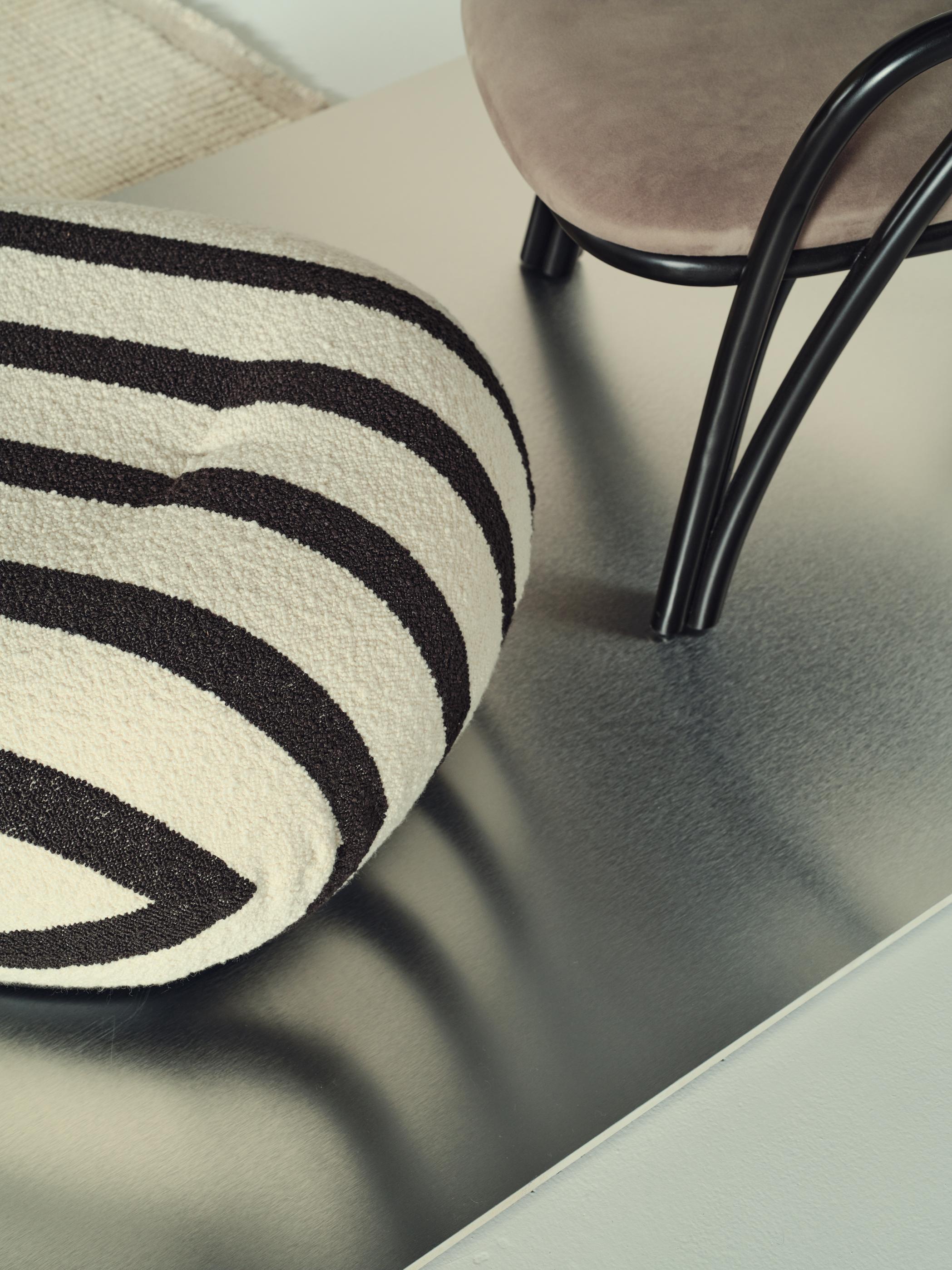 PACHA upholstered pouf with black base