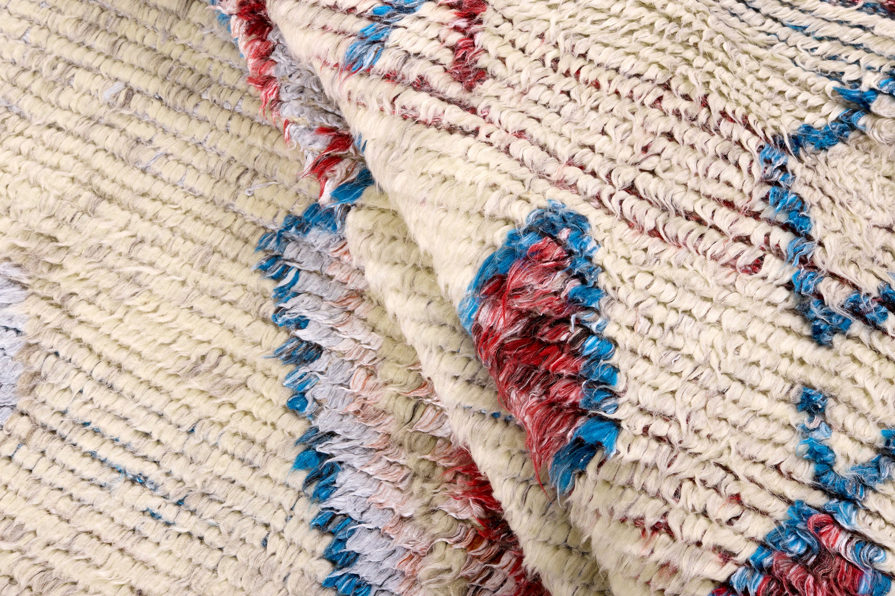 TRIBE beige rug with red and blue
