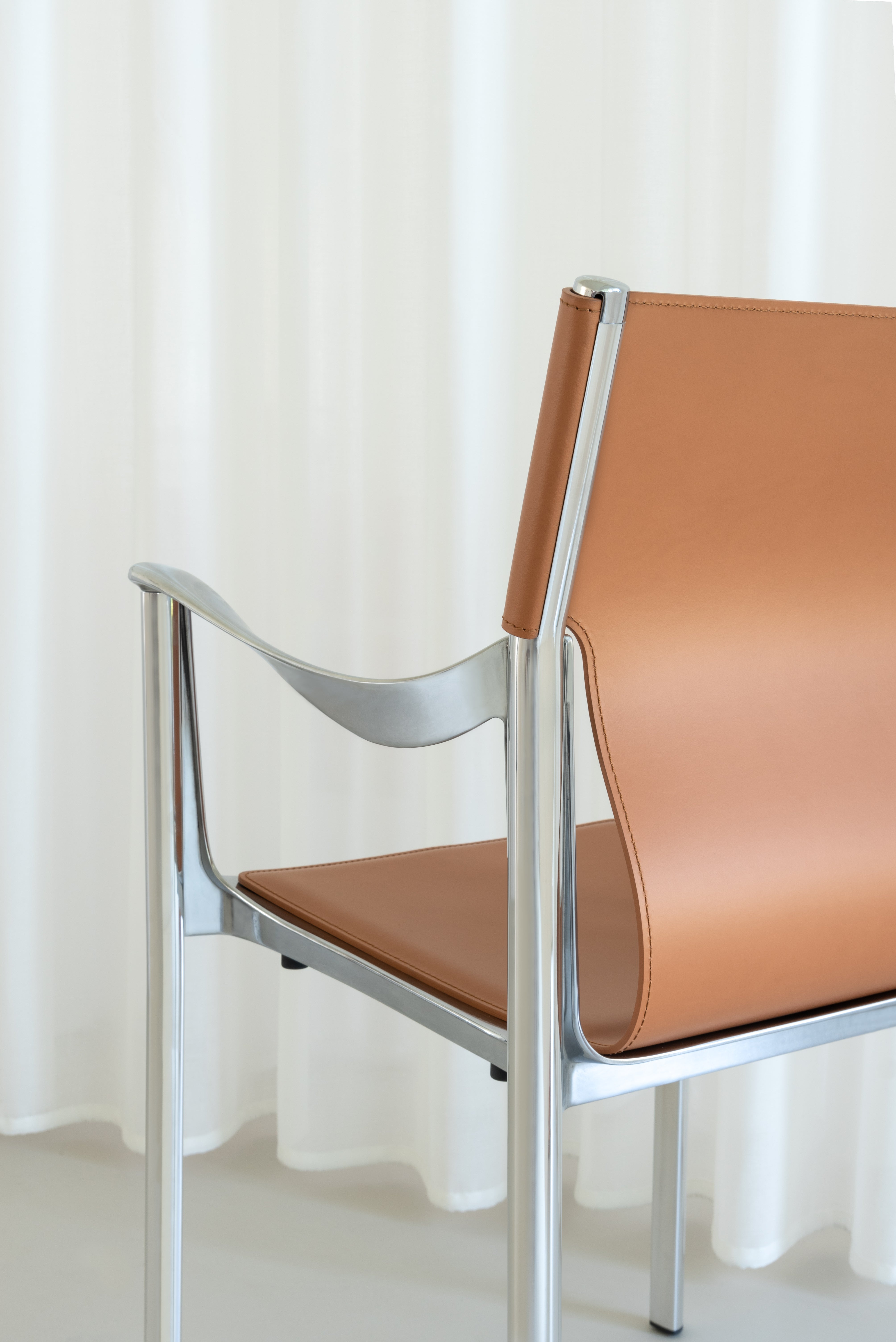 VENICE chair in cognac leather with a polished base