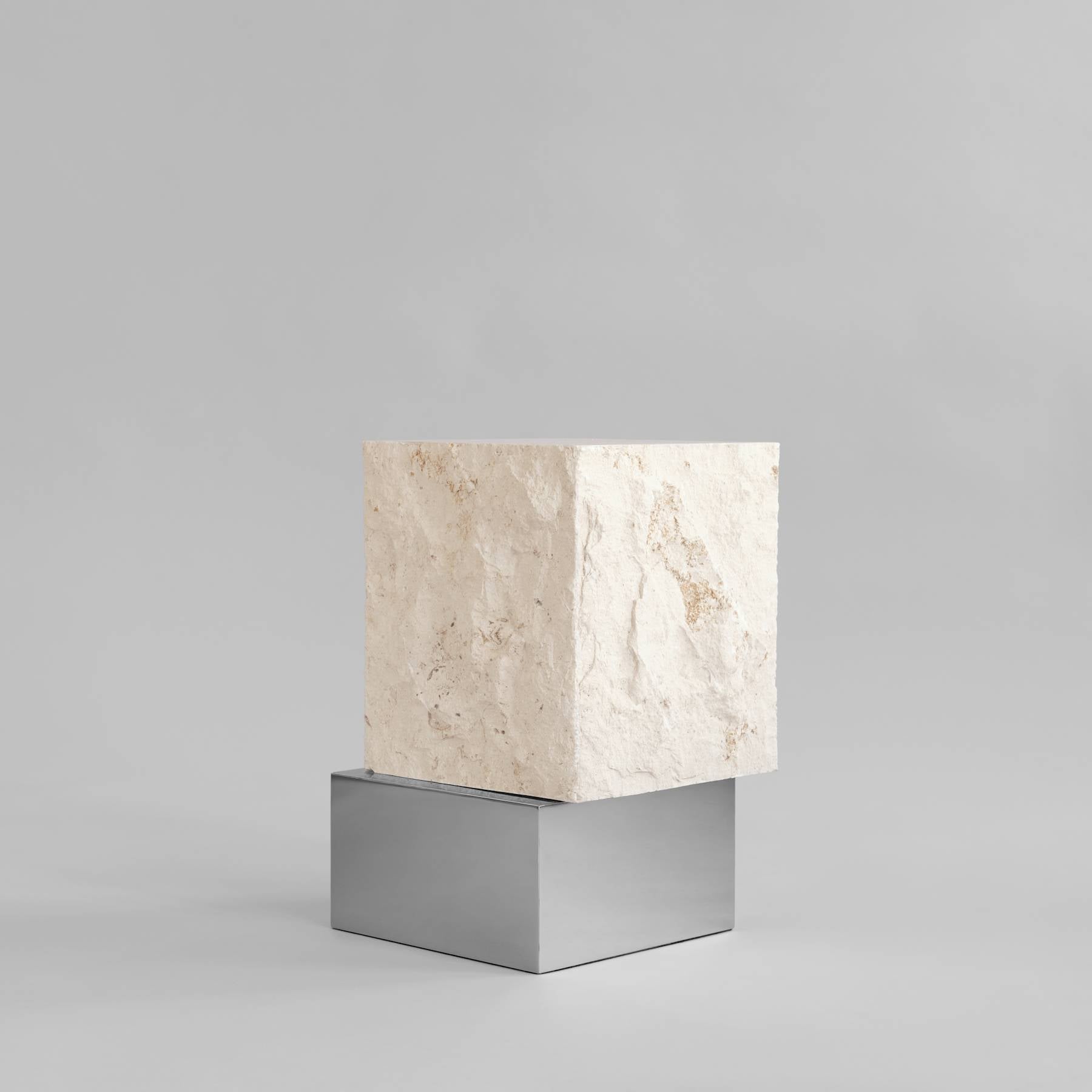 TEMPLE limestone coffee table with a silver base