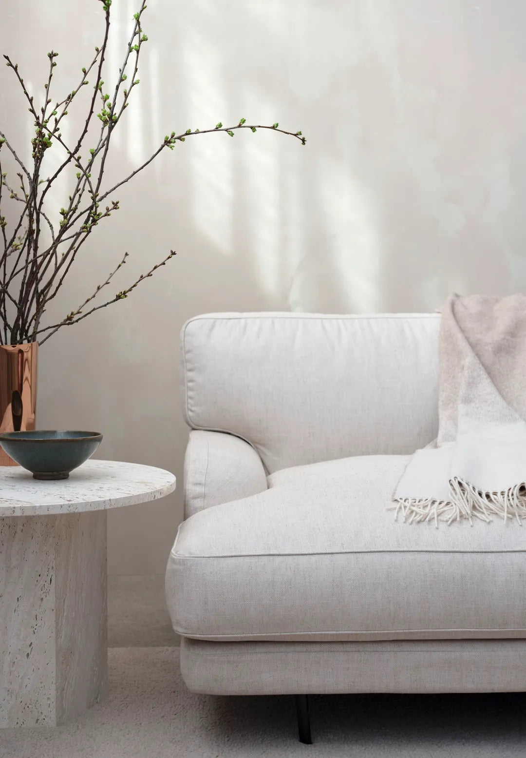 Upholstered FLANEUR armchair with a brass base