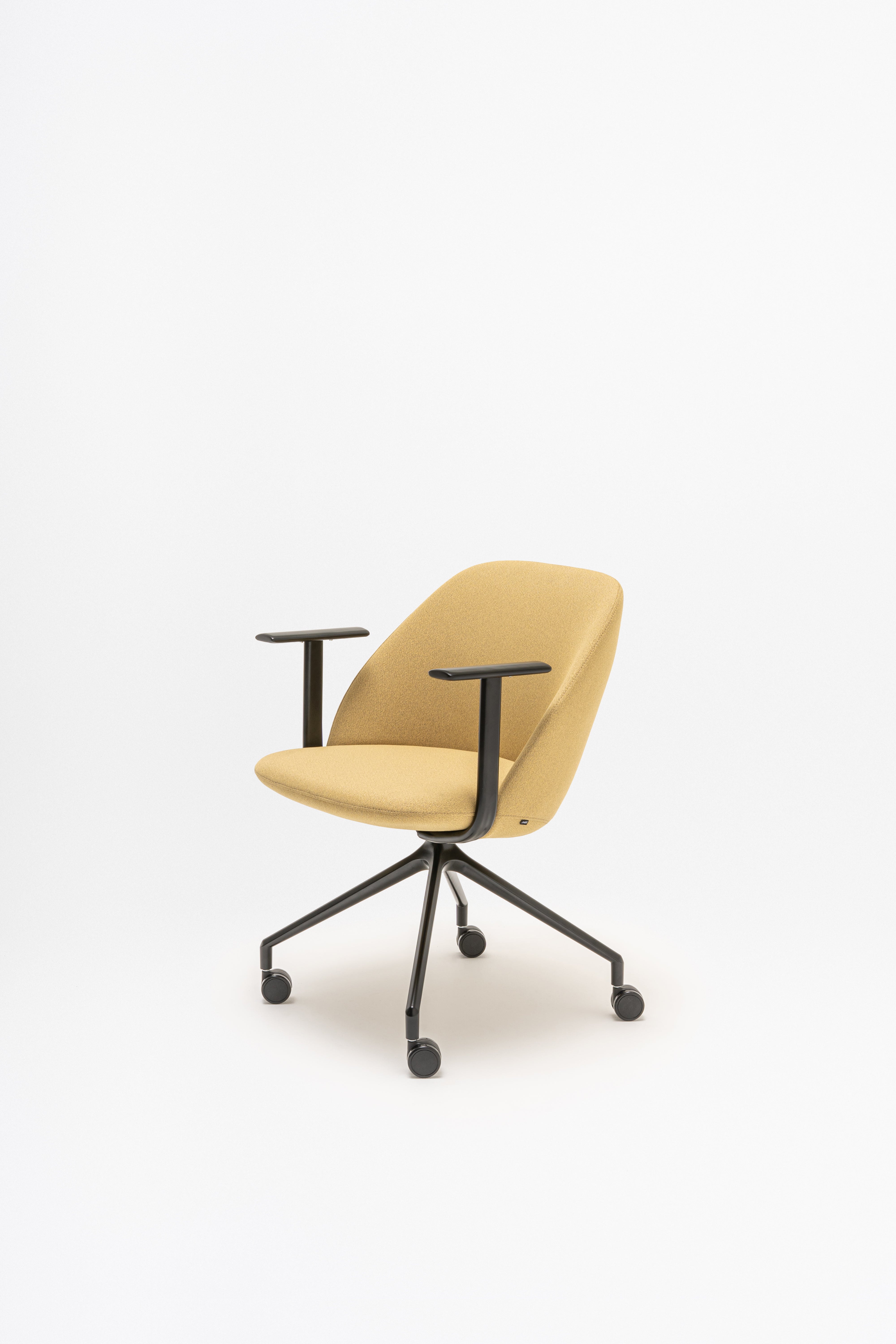Rotable armchair with low backrest metal parallel base with wheels to a soft surface