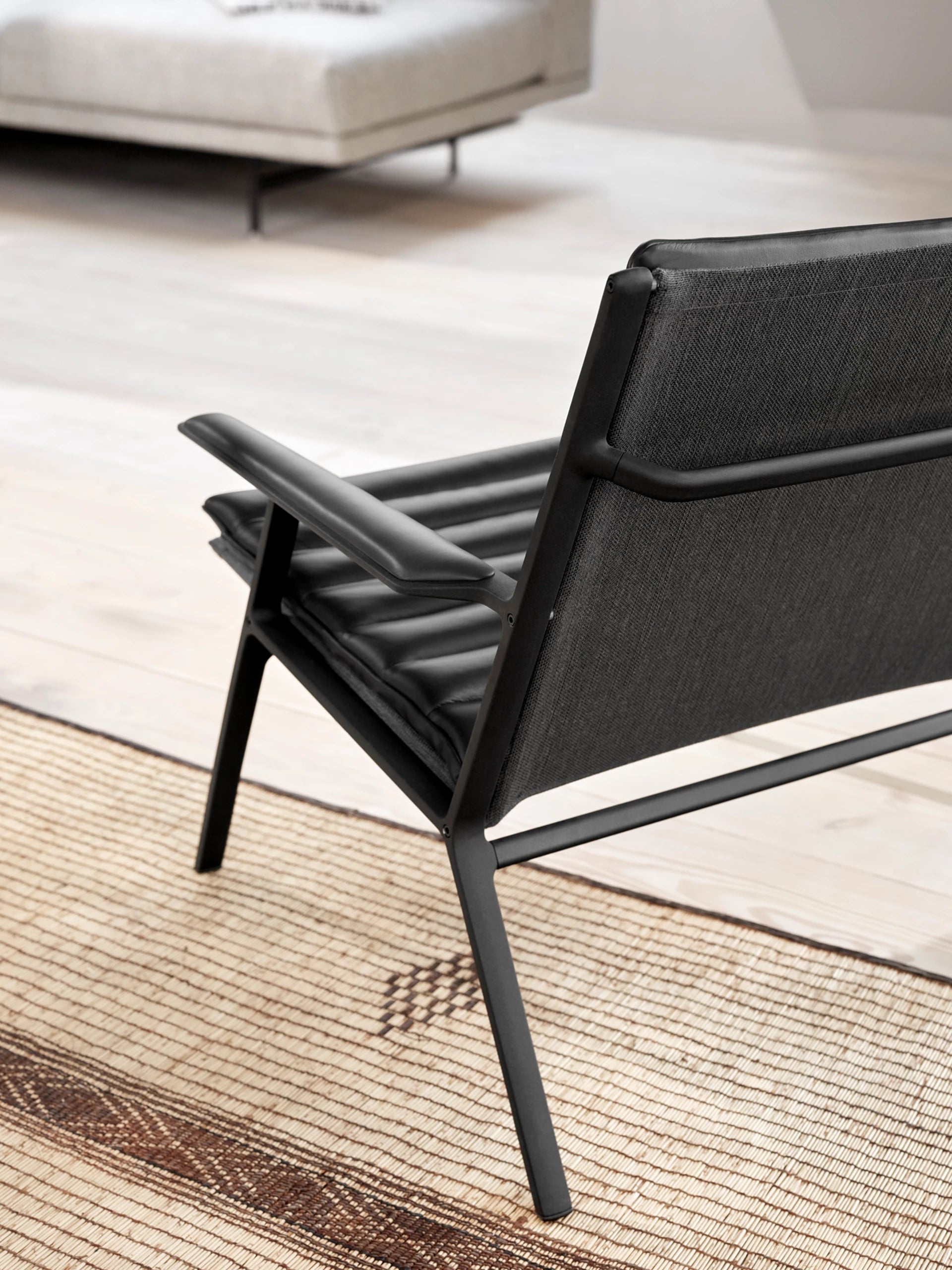 Armchair 456 black leather with dark metal base