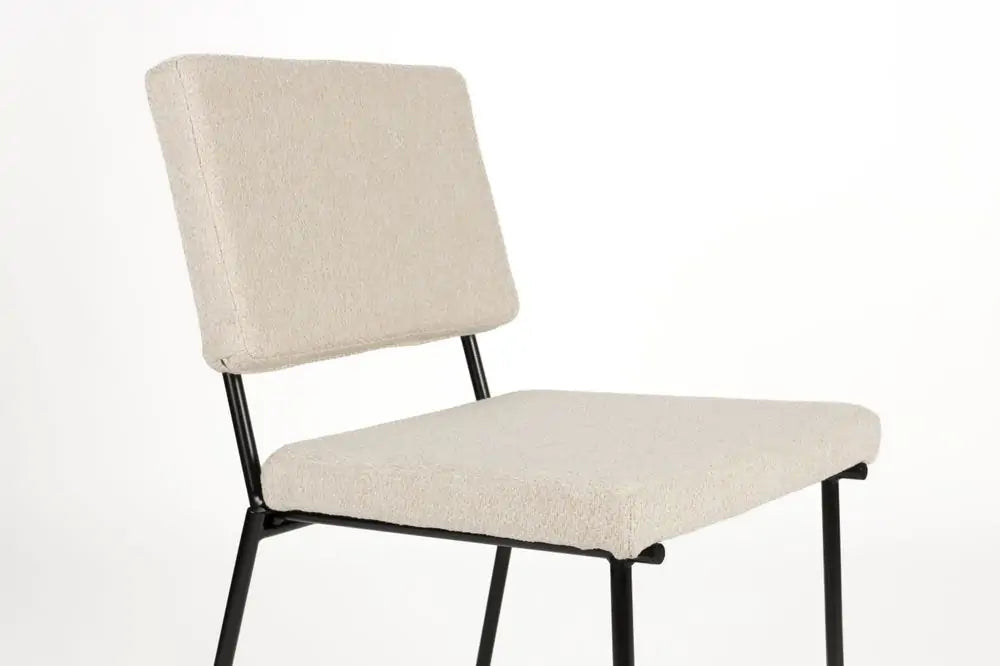 Fellow beige chair with a black base