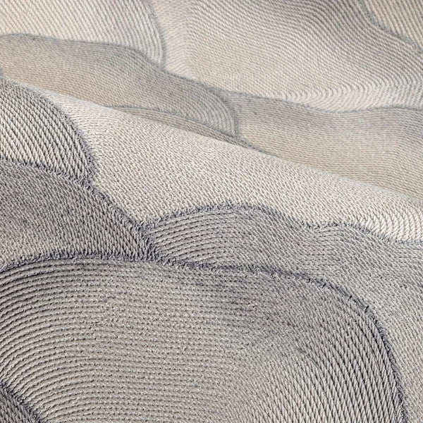 Textured wallpaper resembling fabric with an abstract wave pattern ONDULA gray