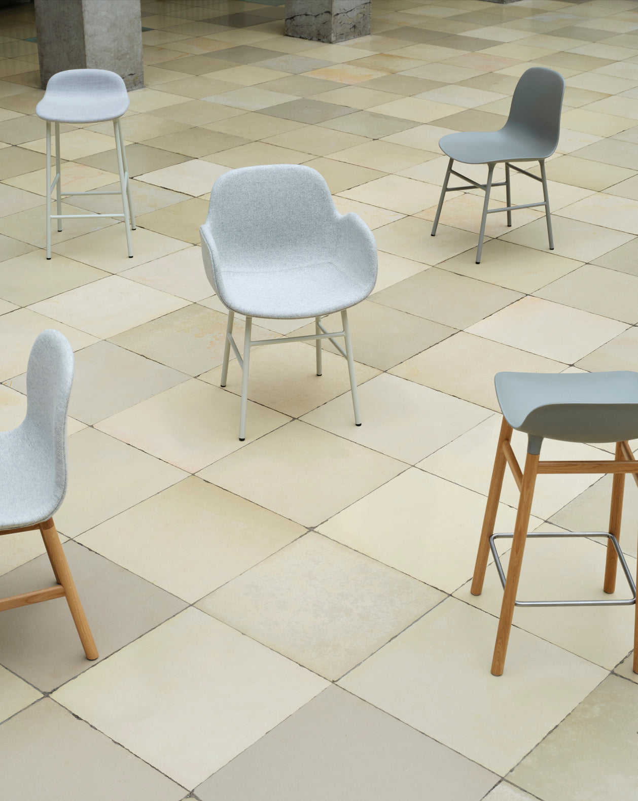 Hocker forms upholstered with a black oak base