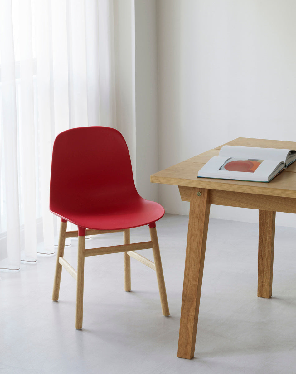 Red forms chair with an oak base