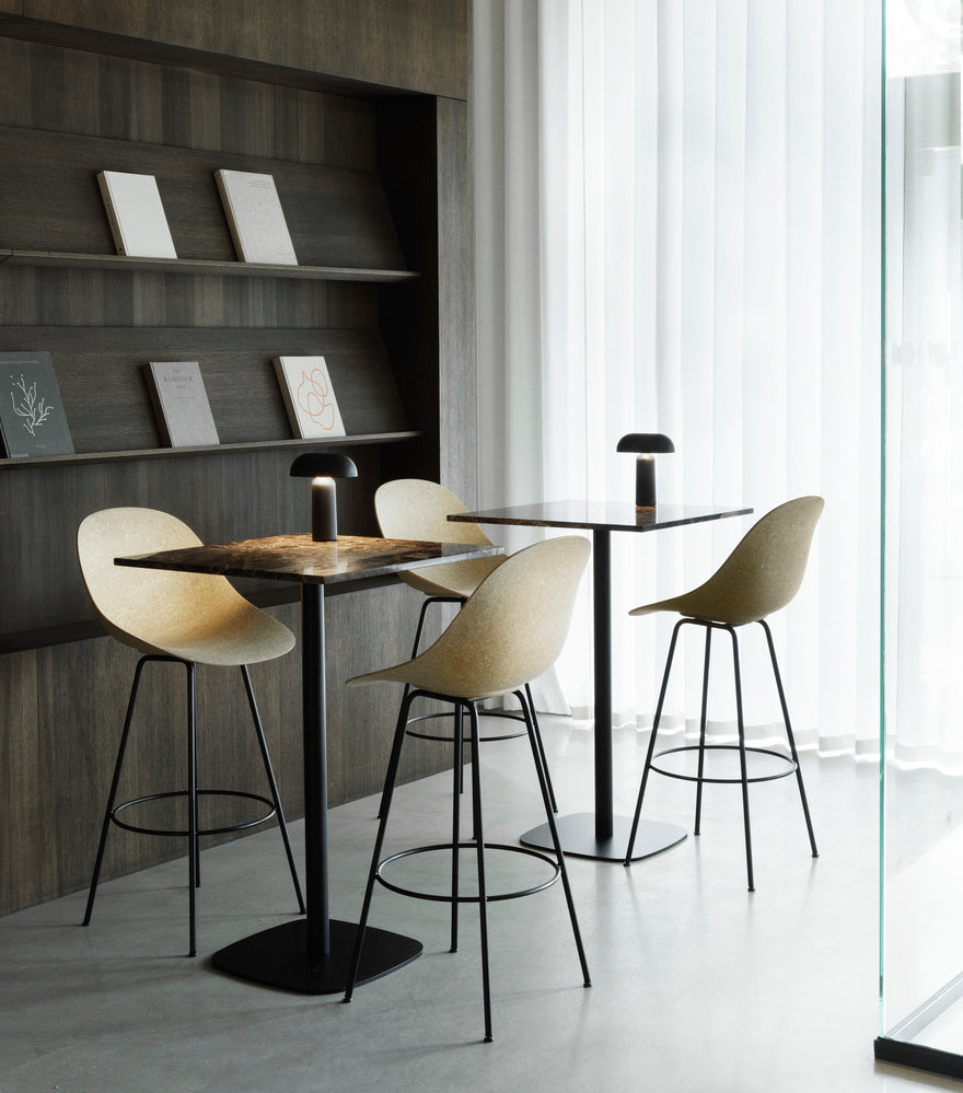 Upholstered bar chair with a black base with a black base