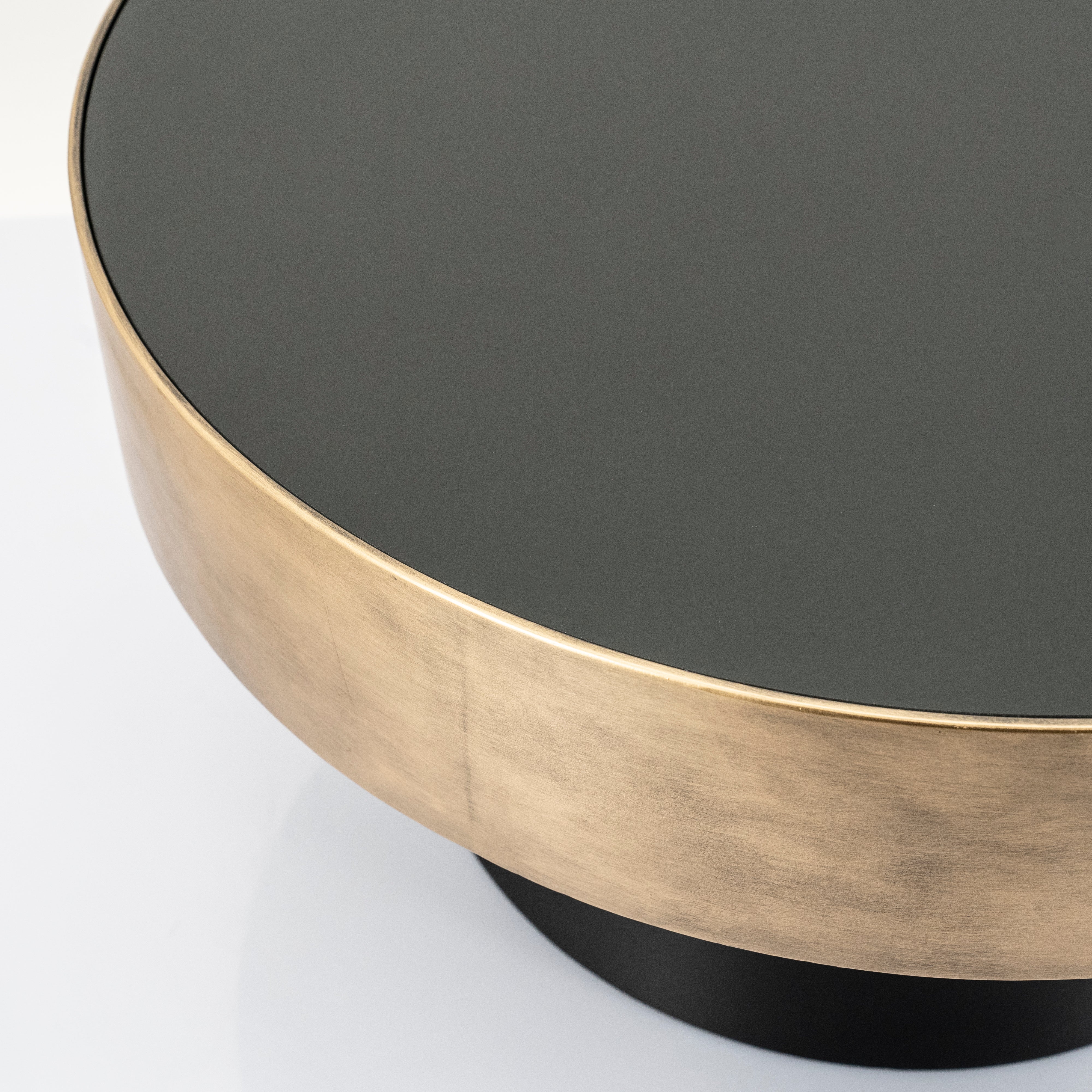 BUNGA coffee table in gold with a black base
