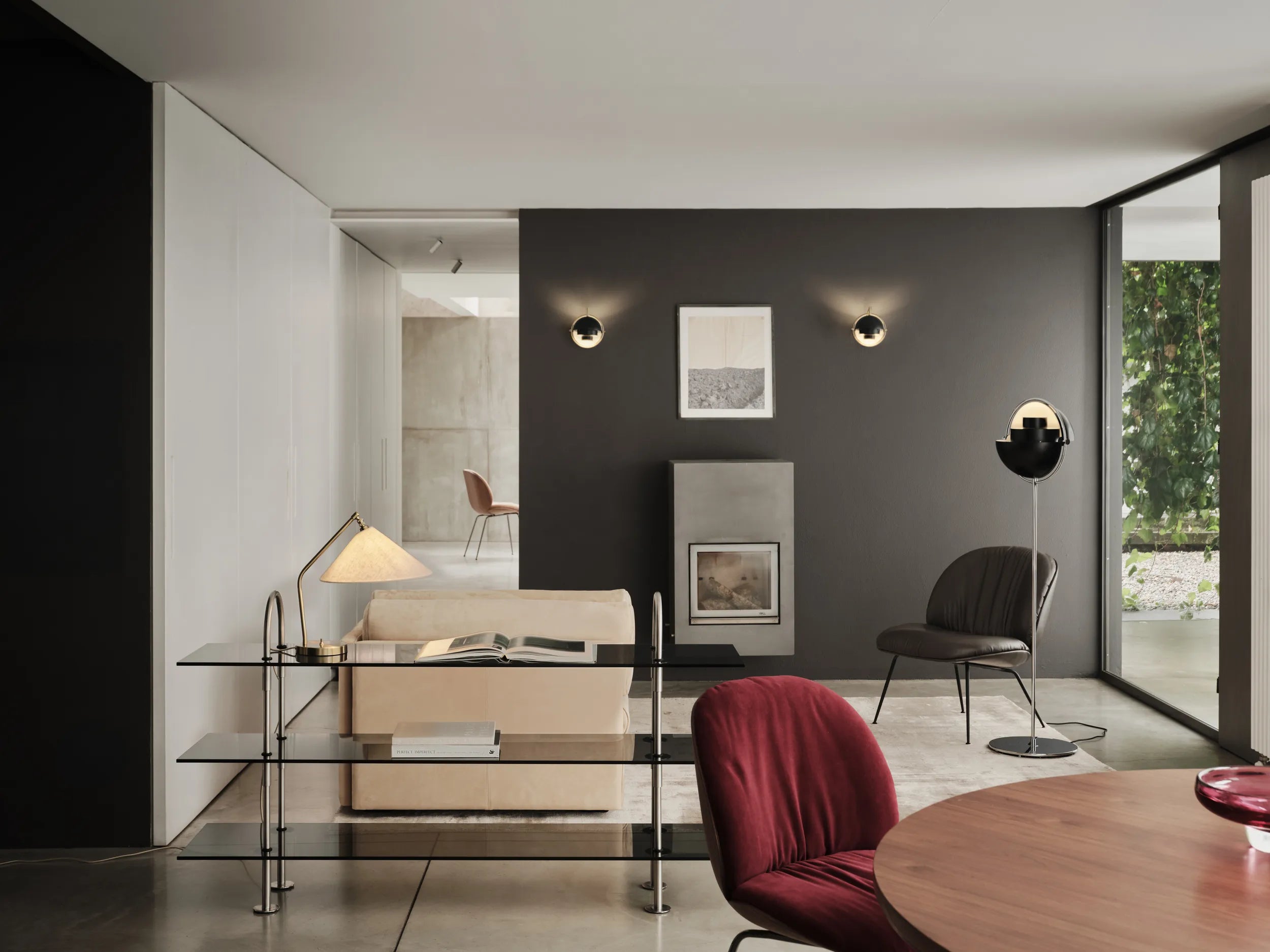 MULTI-LITE wall lamp in black with a brass base