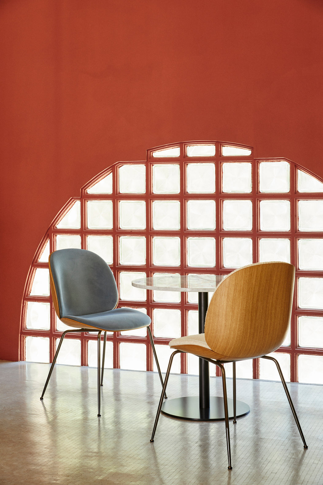 BEETLE upholstered chair with a black base