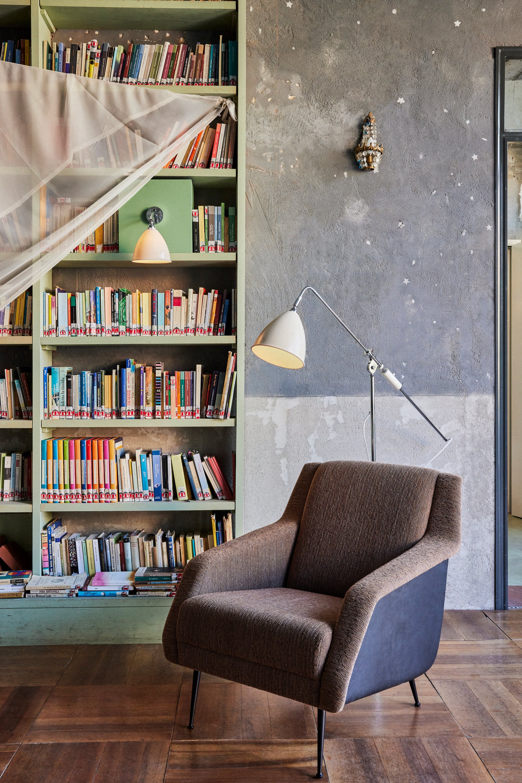 CDC.1 upholstered armchair with a black base
