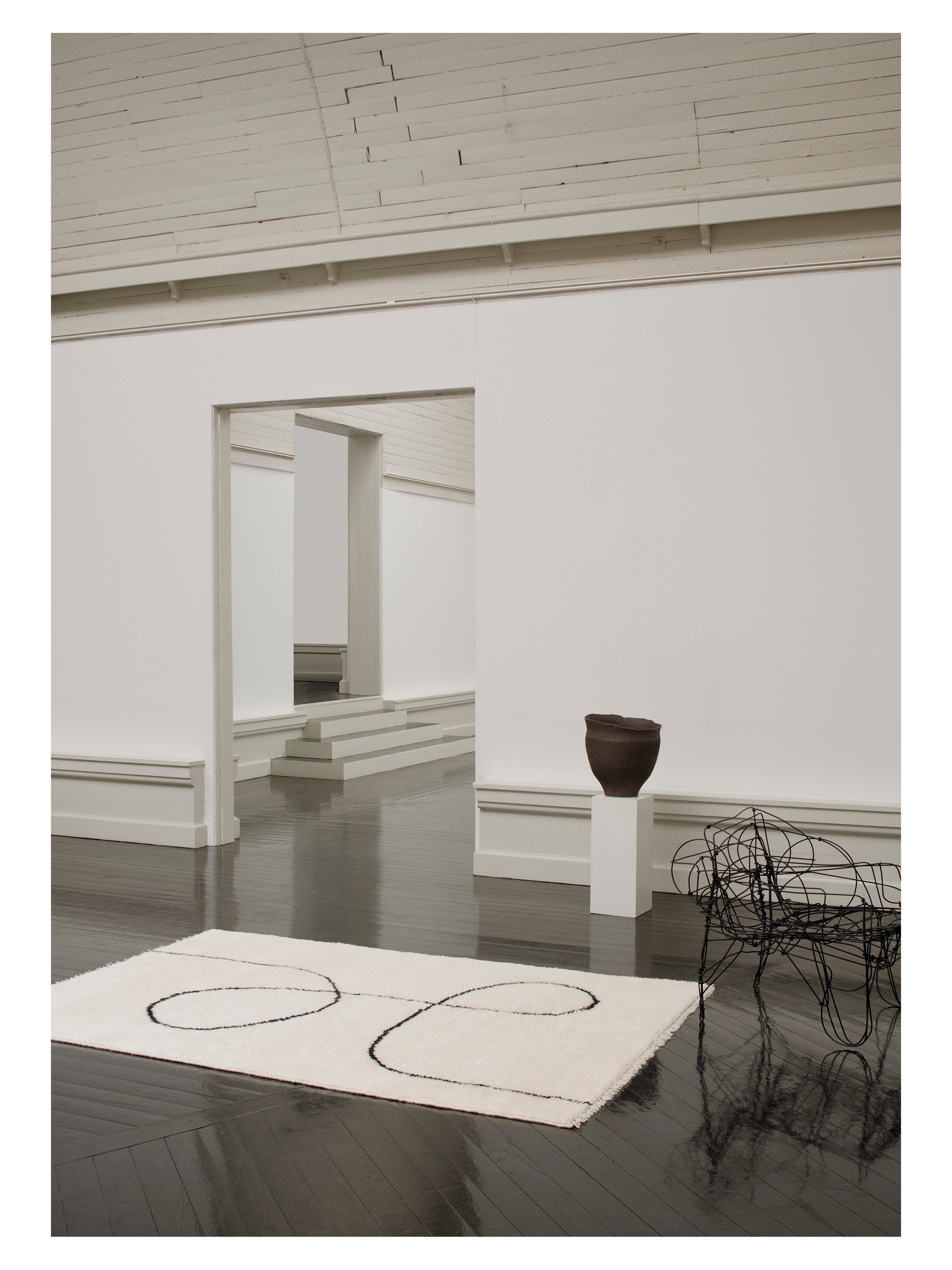 ASTRAL SPIRAL rug broken white with black pattern