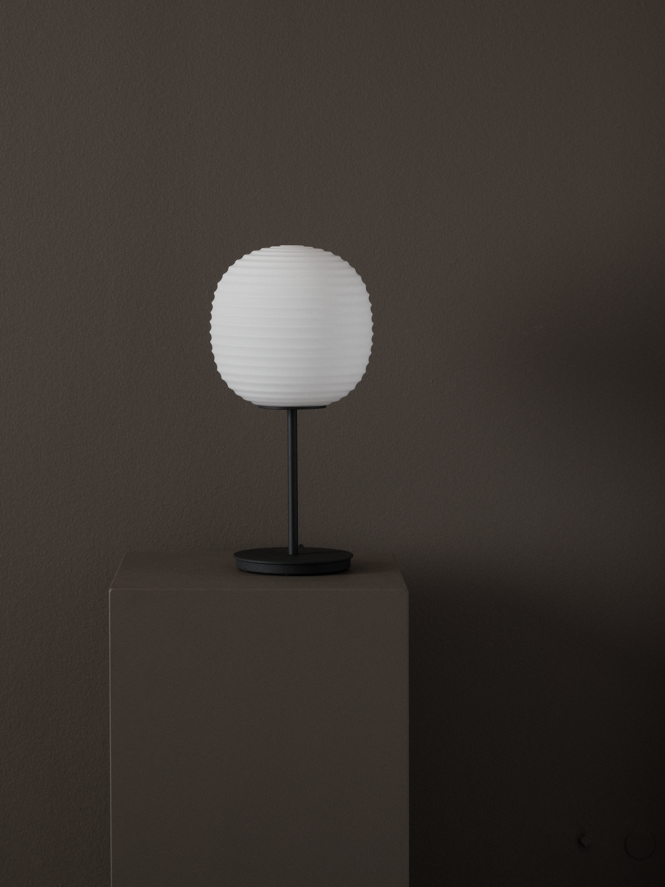 Lantern white table lamp with a black base