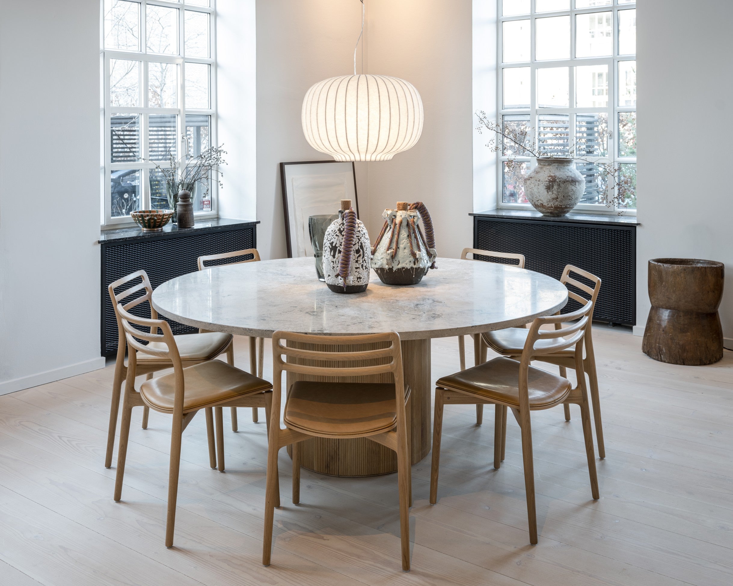 Round Table CABIN with a light oak base and a gray limestone top