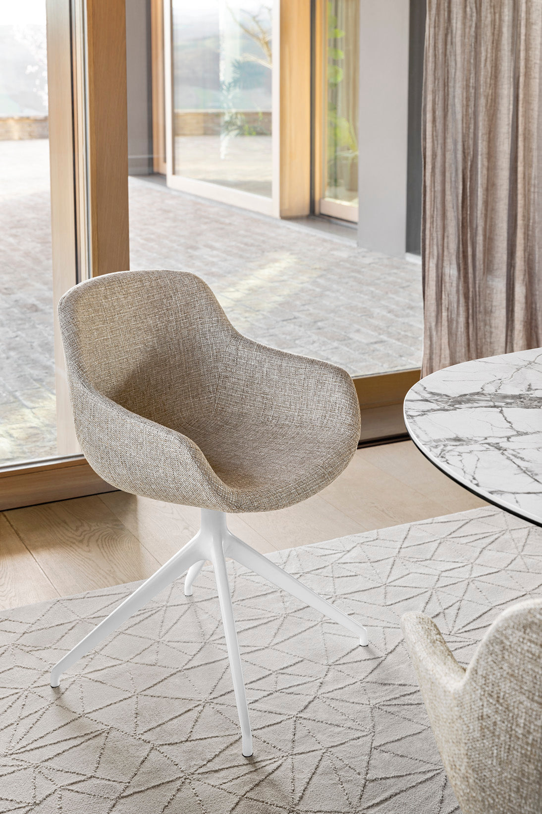 IGLOO upholstered swivel chair with black base