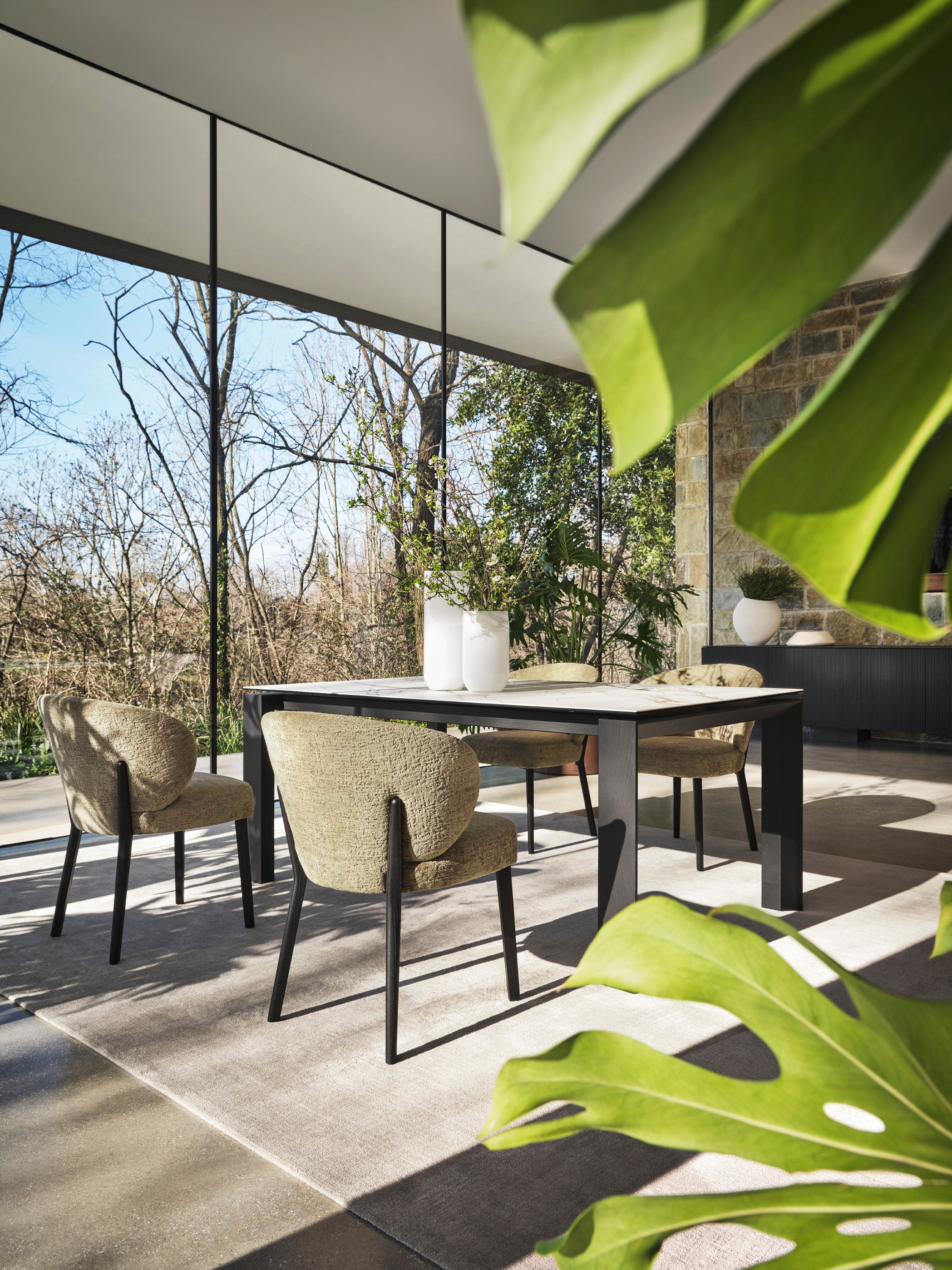 MARA upholstered chair with a black wooden base