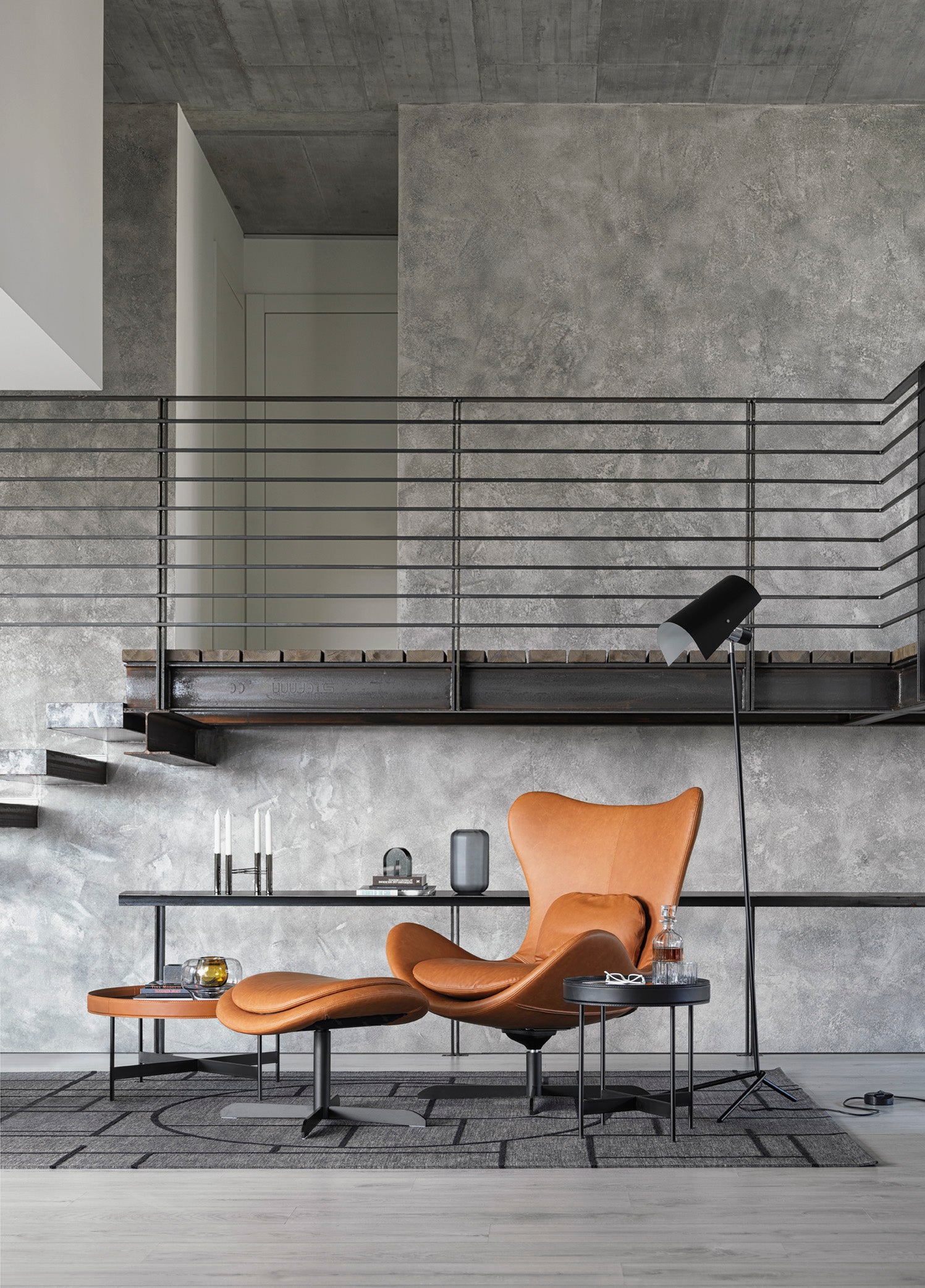 LAZY upholstered swivel armchair with a black metal base