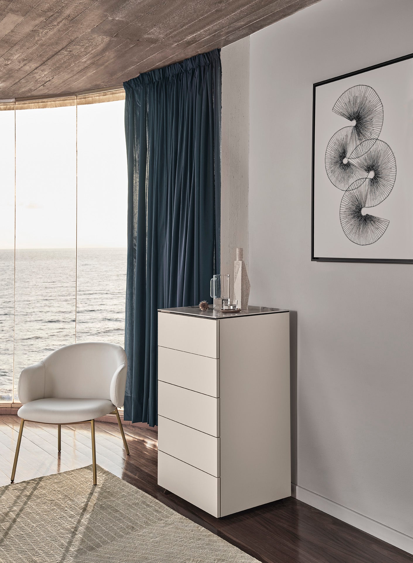 HOLLY upholstered armchair with a black base