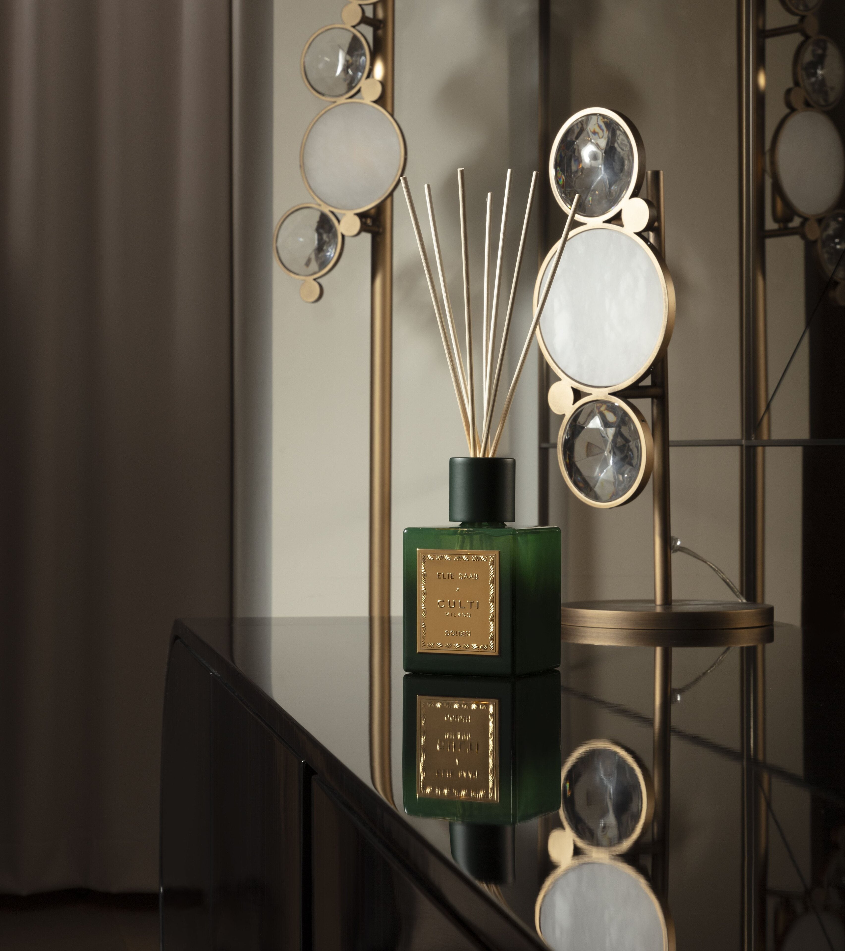 GOLDEN fragrance diffuser with notes of bitter orange, mandarin, ginger, orange blossom, and cedar.