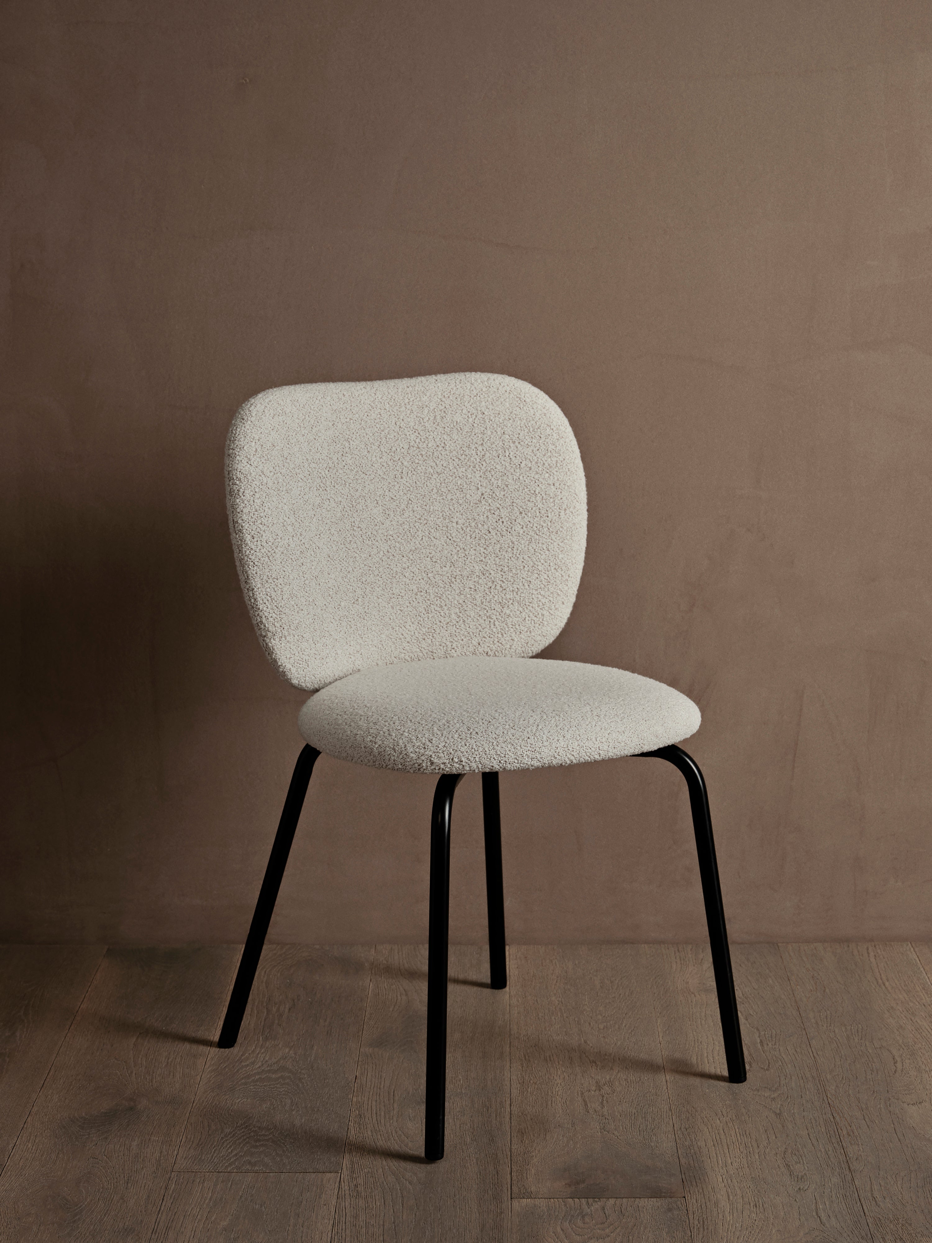 Rico Soft Bouclé chair broken white with a black base