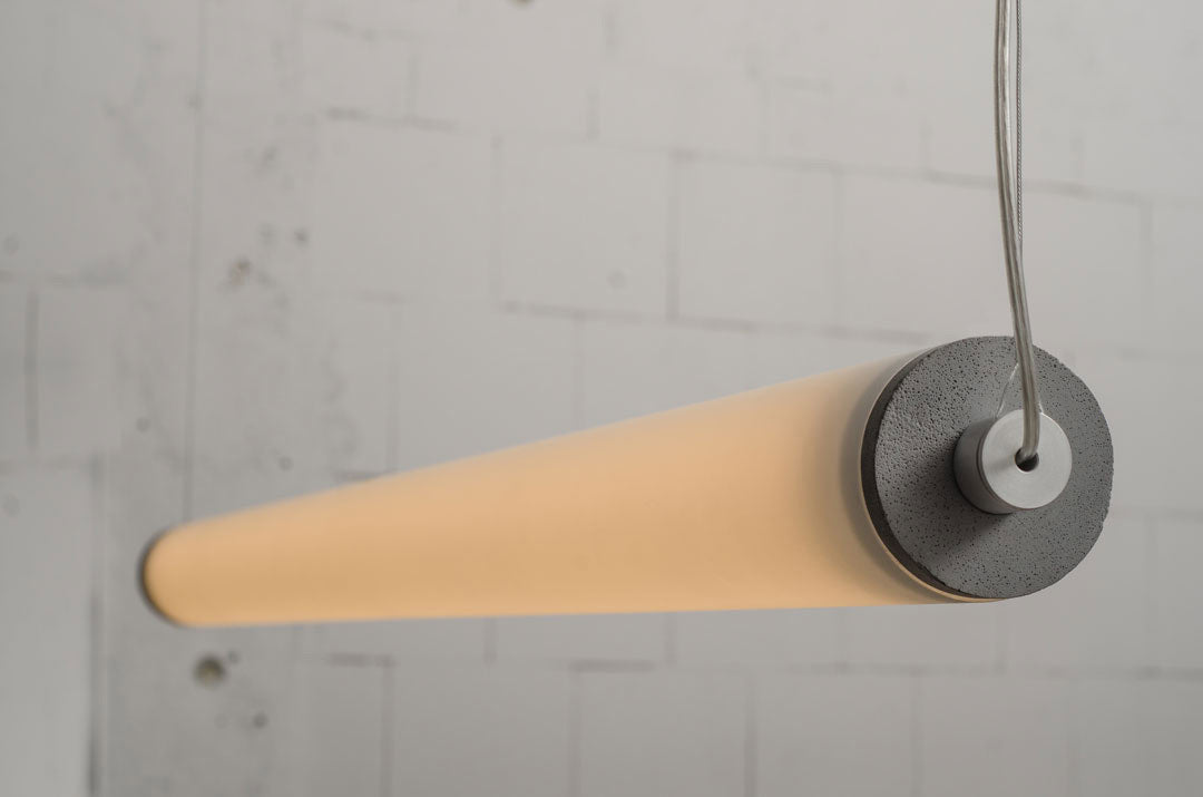 LONGA horizontal pendant lamp with a milky shade and concrete detail