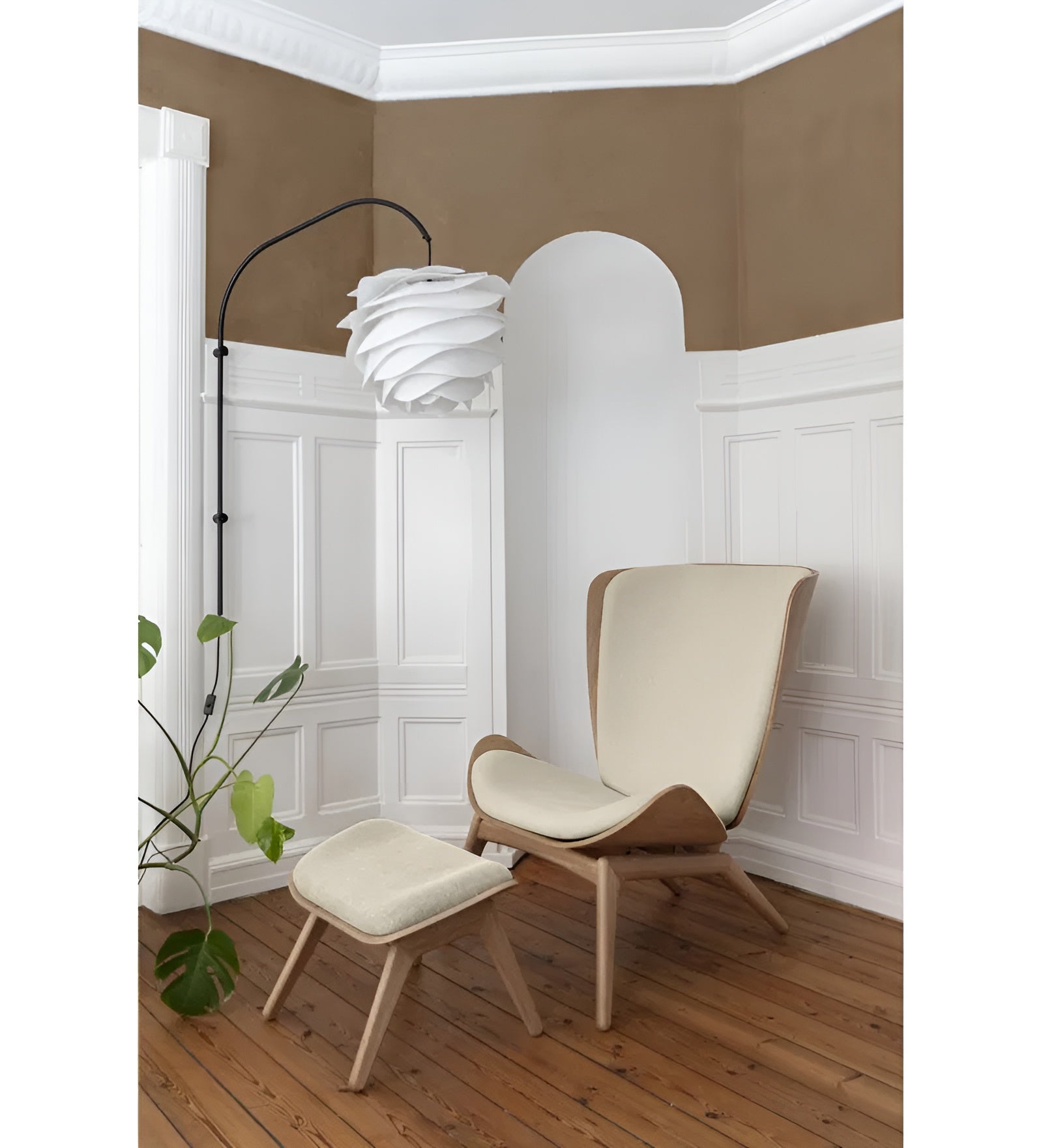 READER footstool in sand with a black base