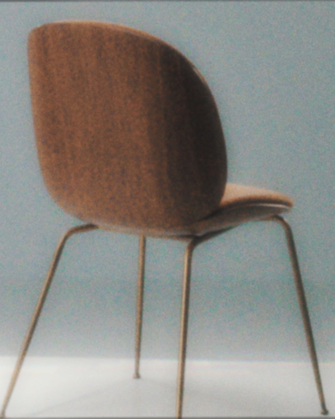 BEETLE upholstered chair with a black base