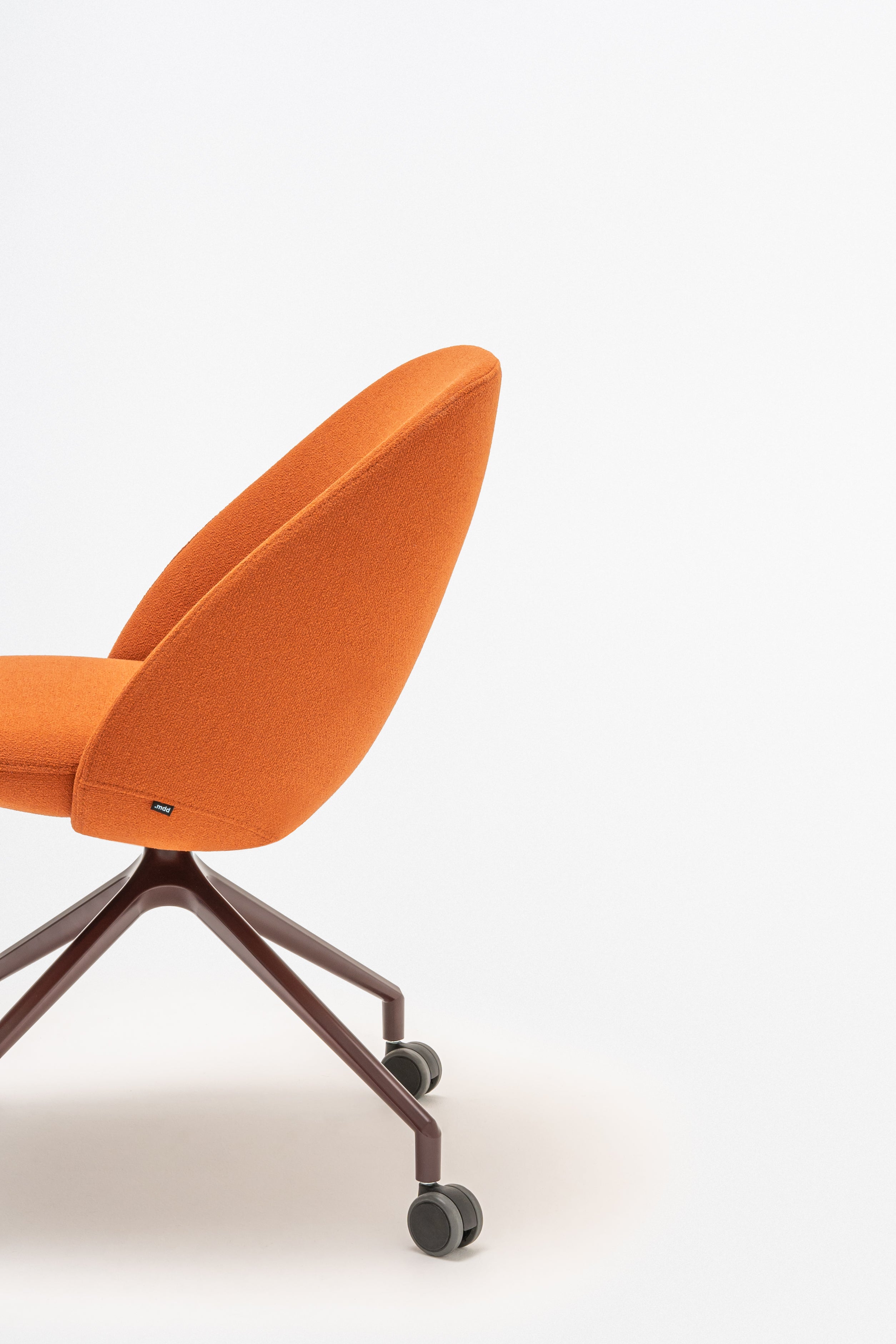 Swivel armchair with low back, a metal parallel base with wheels to a hard surface