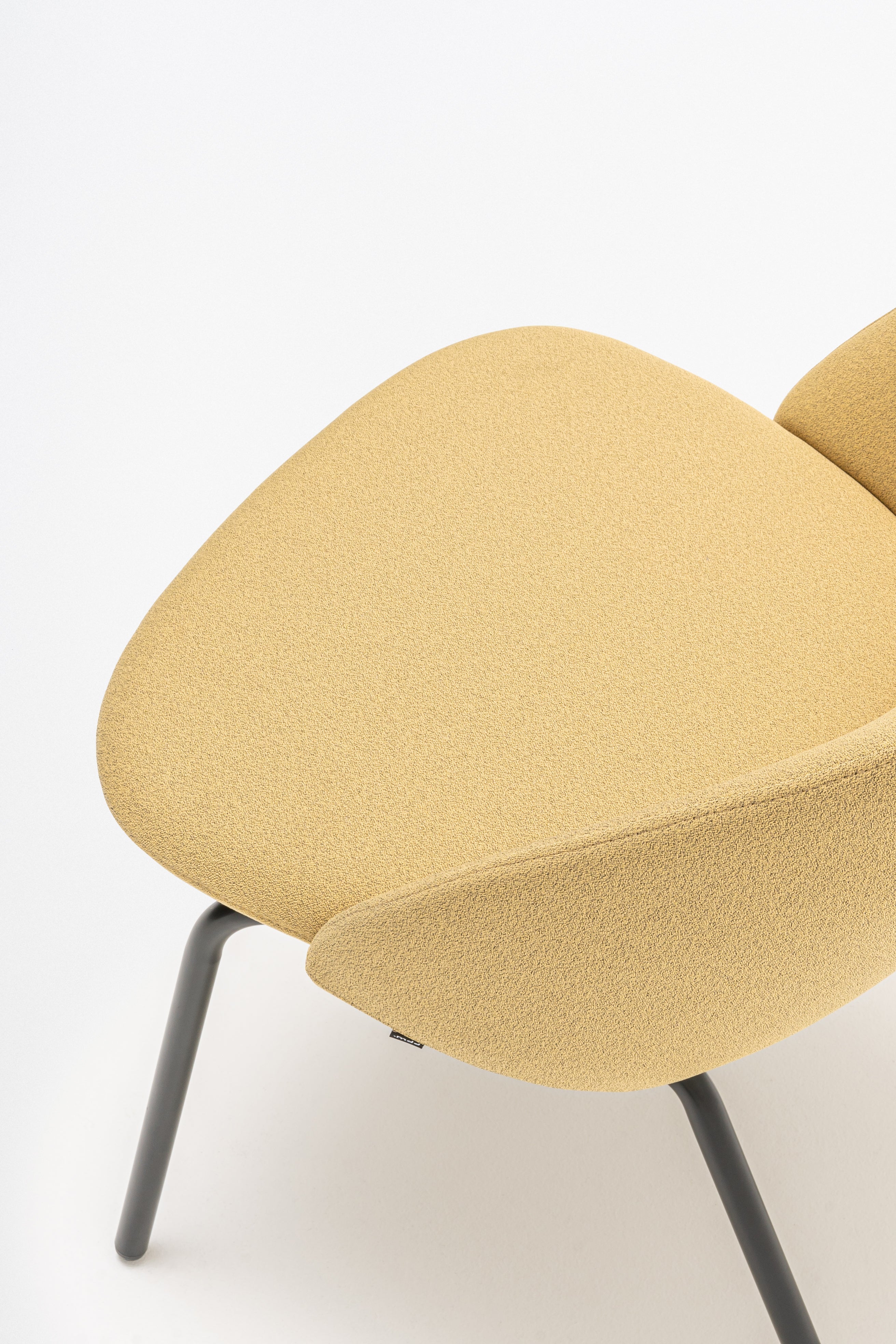 Armchair with low backrest parallel four -legged base