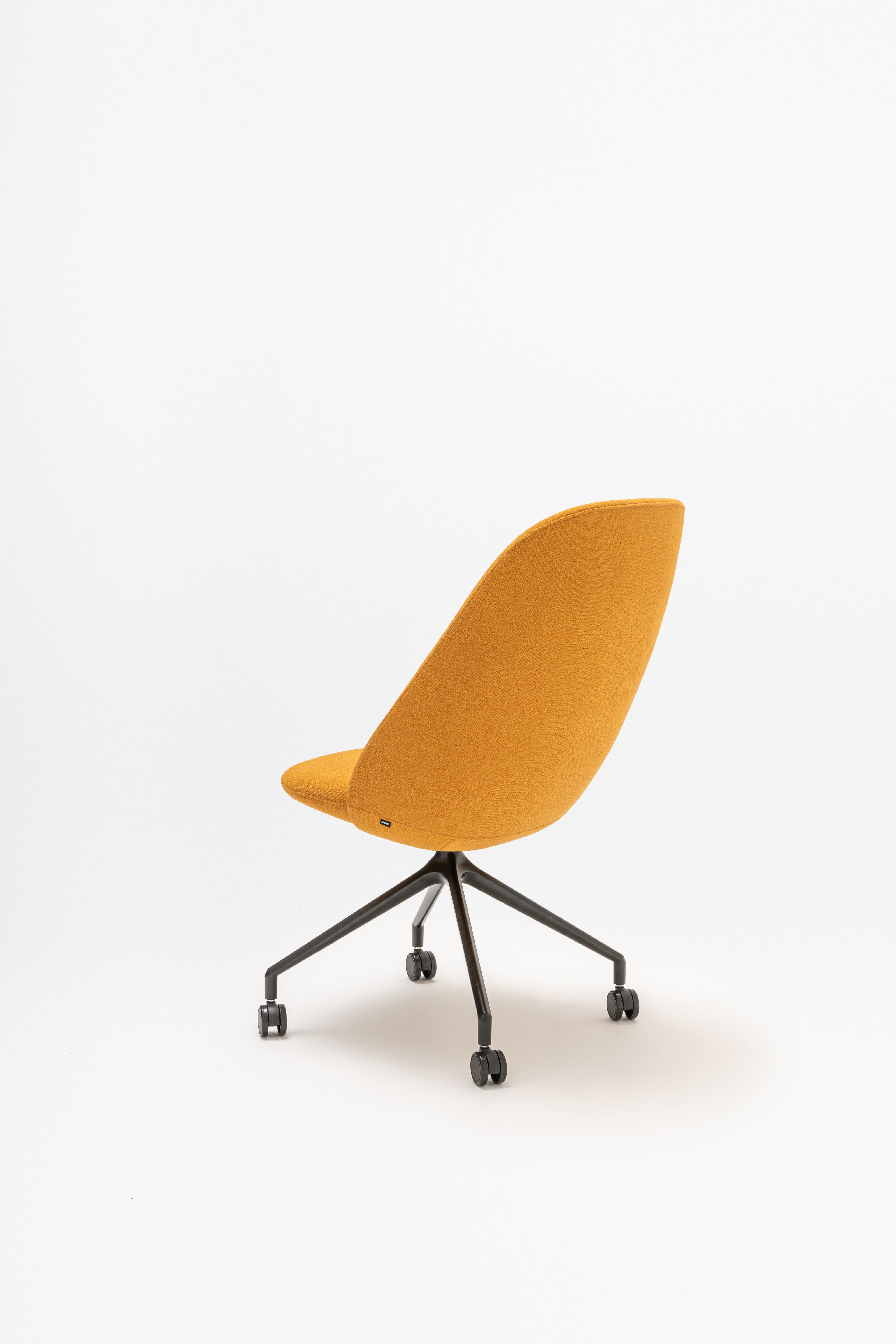 Rotable armchair with a high back parallel metal base with wheels to a hard surface