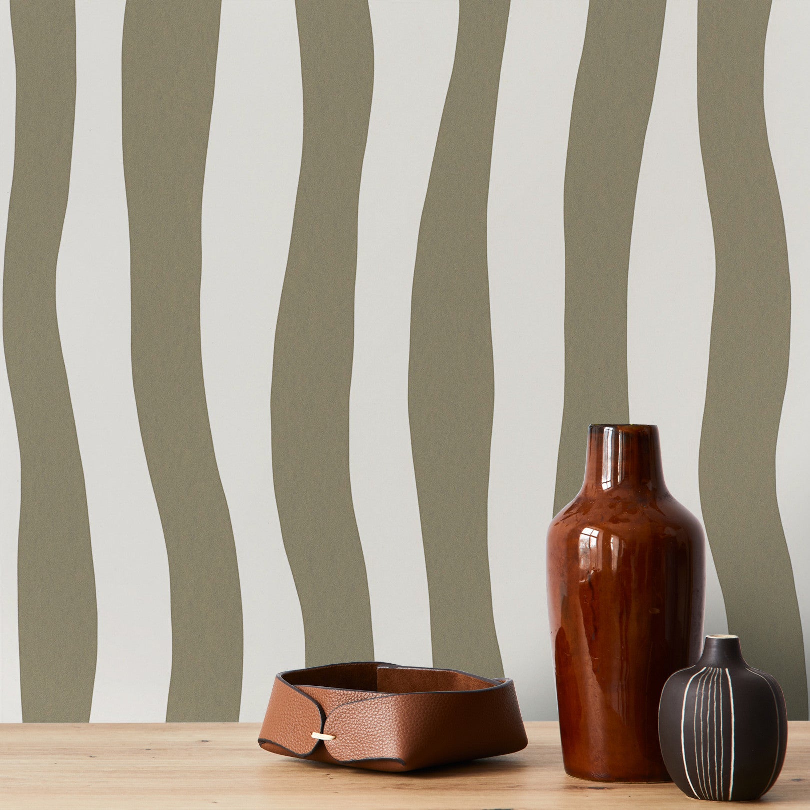 Structural wallpaper with an abstract wavy stripe pattern SUNDAE - ARGILE clay green