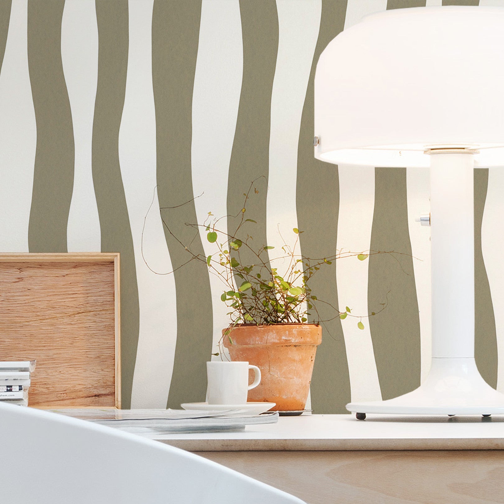 Structural wallpaper with an abstract wavy stripe pattern SUNDAE - ARGILE clay green