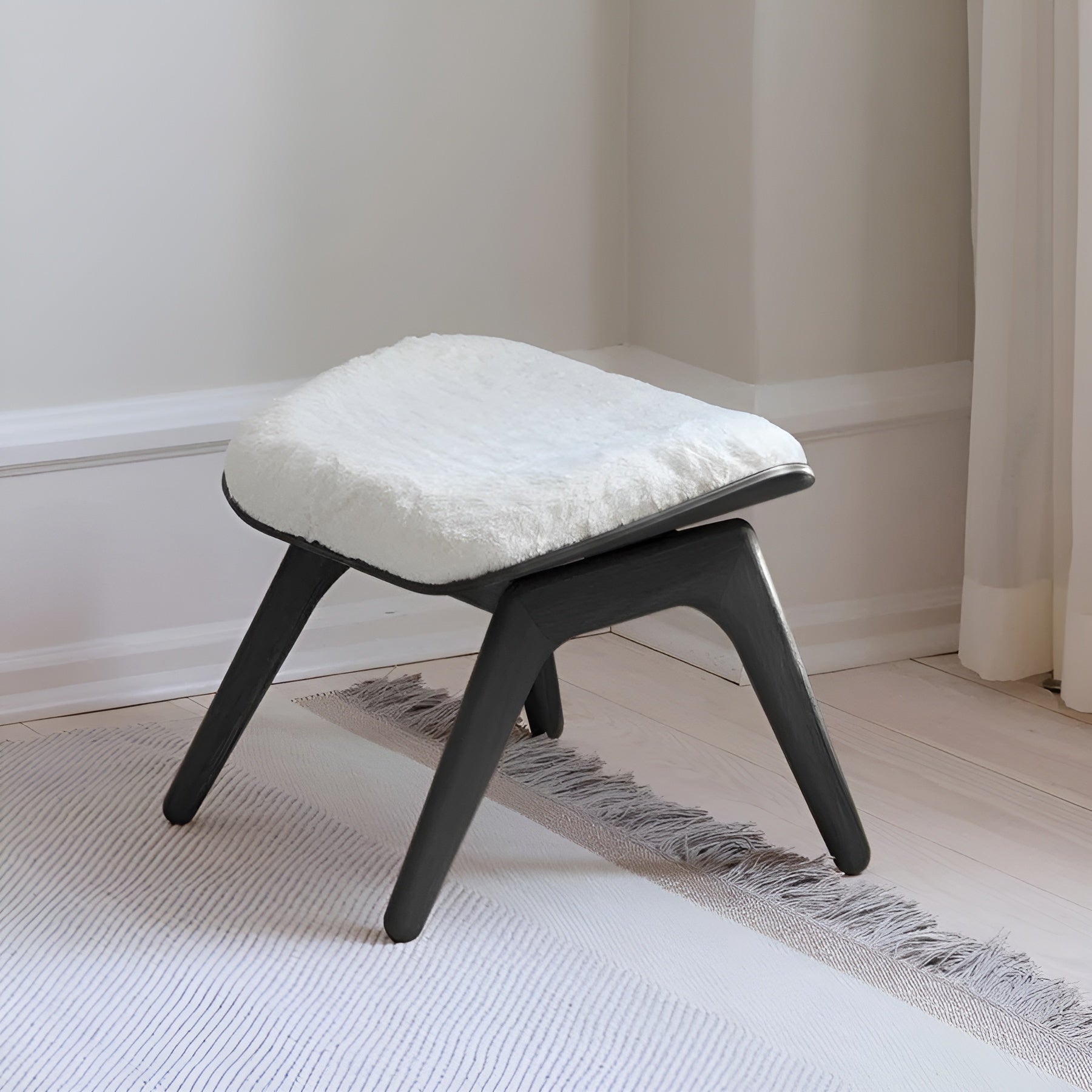 READER white plush footrest with black base